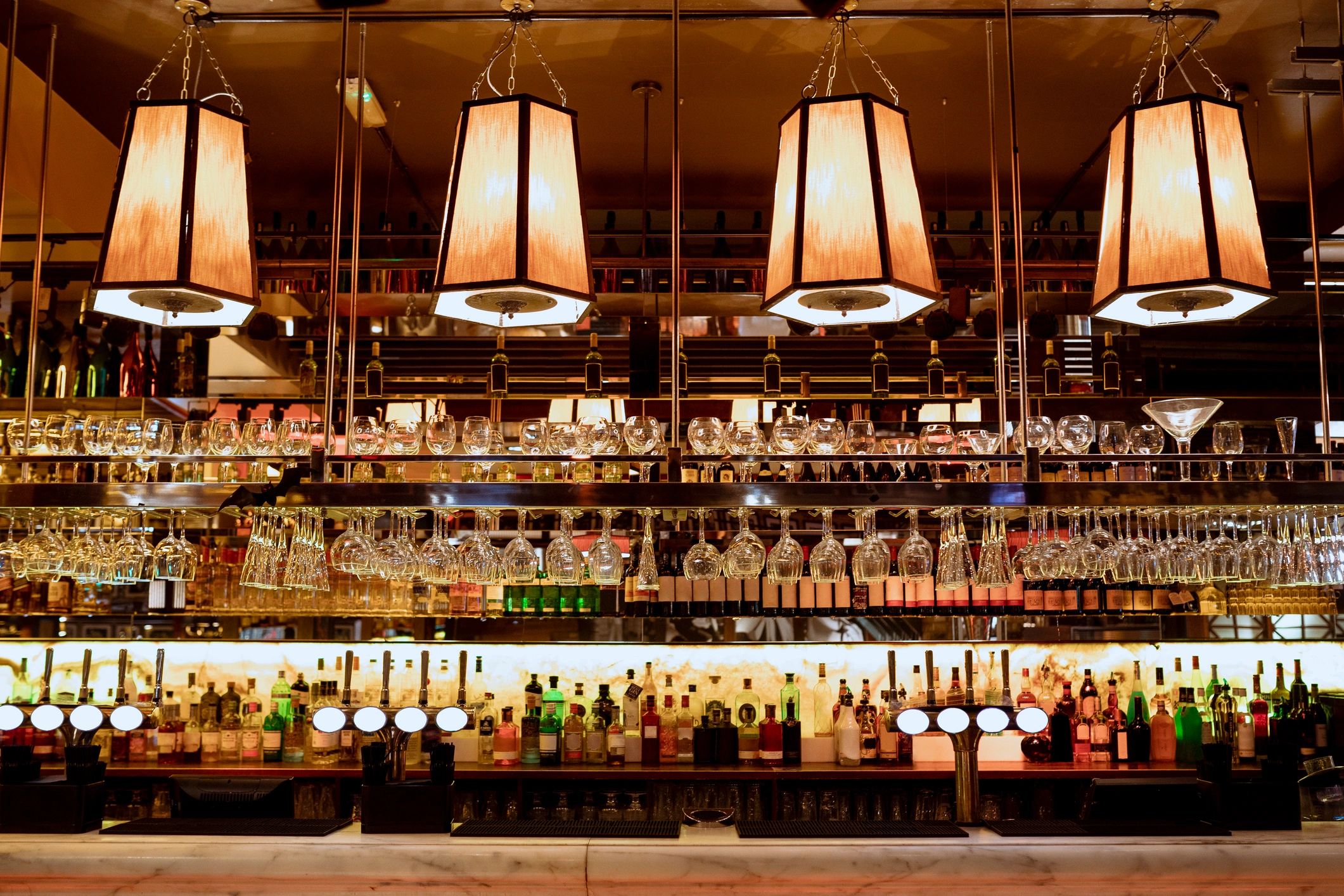 An array of creative cocktails on the bar.